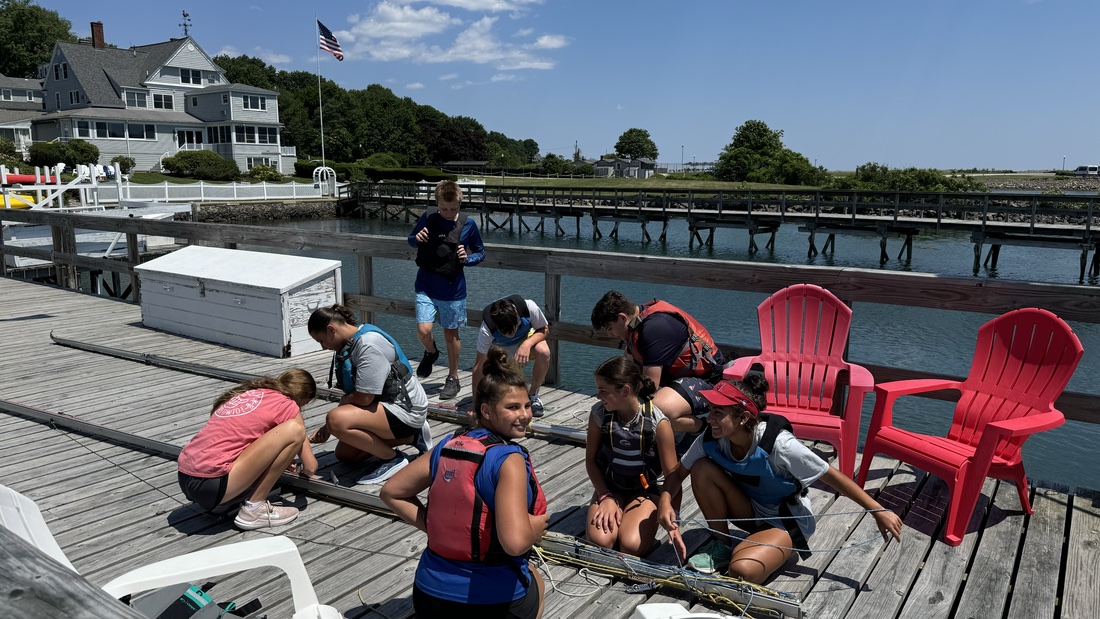 AYC sailors learning together on the dock