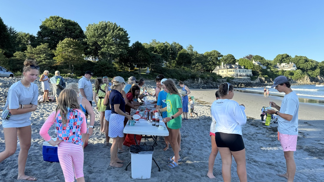 AYC families gathering on the beach